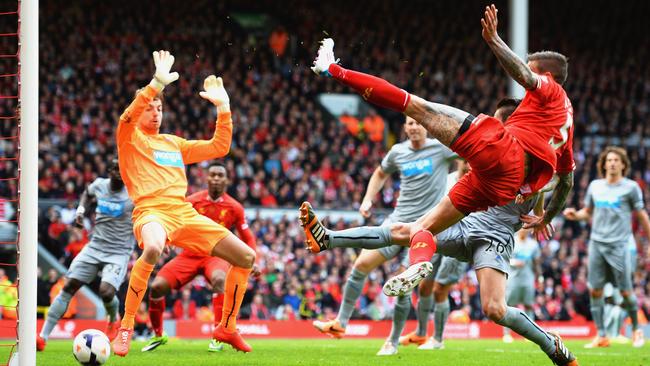 Daniel Agger scores acrobatically past Tim Krul.