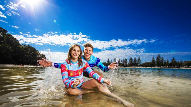 Claire Kavanagh and Cody Wesseling at a Gold Coast beach as humidity levels soar. Picture: Nigel Hallett