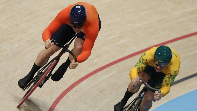 Netherlands' Harrie Lavreysen and Australia's Matthew Richardson compete in the men's track cycling sprint final race 2 for gold of the Paris 2024 Olympic Games at the Saint-Quentin-en-Yvelines National Velodrome in Montigny-le-Bretonneux, south-west of Paris, on August 9, 2024. (Photo by Thomas SAMSON / AFP)