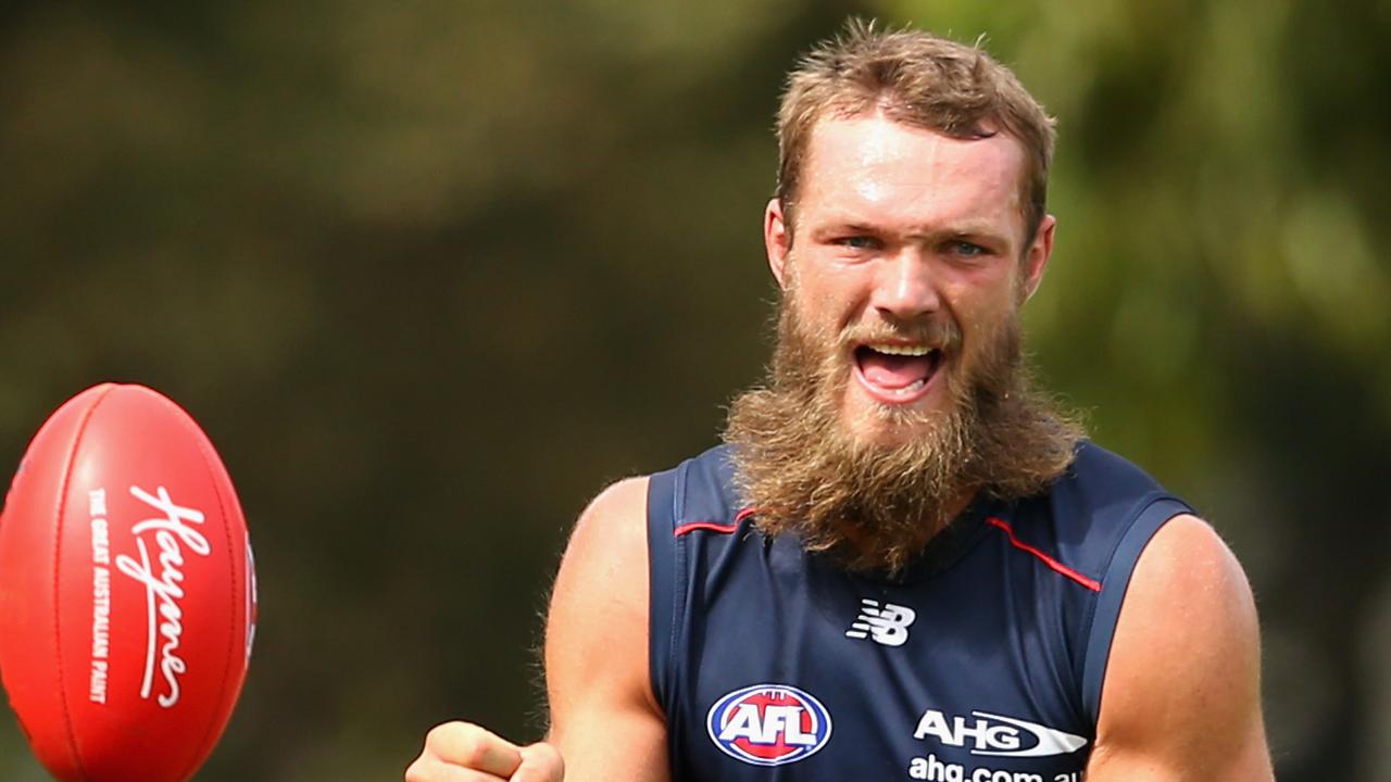 MELBOURNE, AUSTRALIA - FEBRUARY 23: Max Gawn of the Demons handballs during a Melbourne Demons AFL training session at AAMI Park on February 23, 2016 in Melbourne, Australia. (Photo by Quinn Rooney/Getty Images)