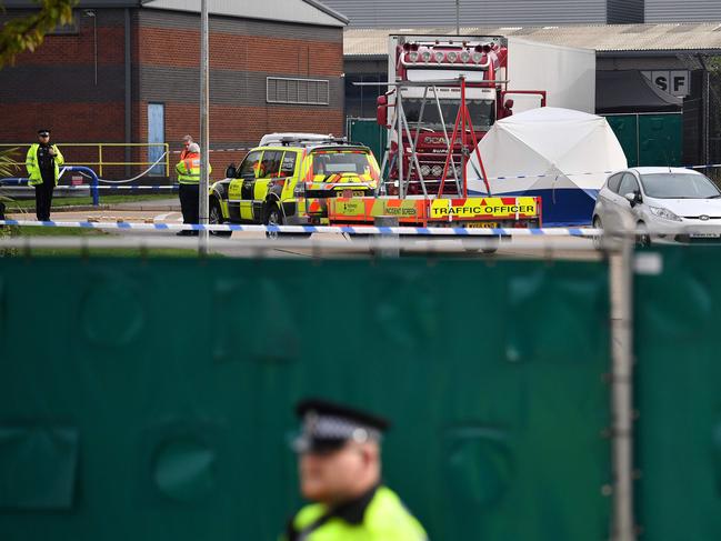 British Police officers stand on duty at a cordon near to where a truck was found with 39 bodies inside. Picture: AFP