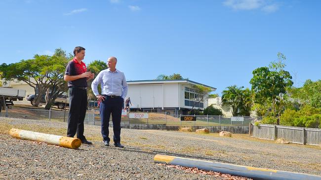 Principal Michael Hurst and Member for Gladstone Glenn Butcher discuss funding to upgrade the "unofficial" carpark at Boyne Island State School.