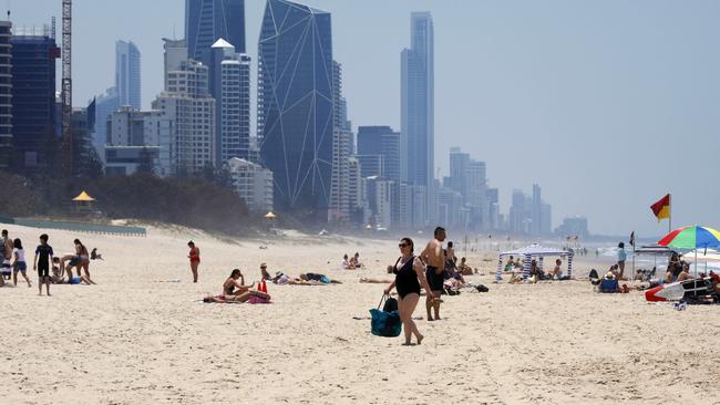 Swimmers on Broadbeach swelter through a Gold Coast heatwave. Picture: Tertius Pickard