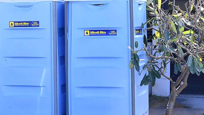 Portaloos outside the home on Monday. Picture: John Gass