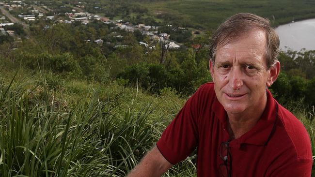 Mayor of Cook shire council , Peter Scott , on Grassy Hill overlooking Cooktown and the Endevour River, happy that the town of Cooktown escaped lightly from Cyclone Ita , Cape York.