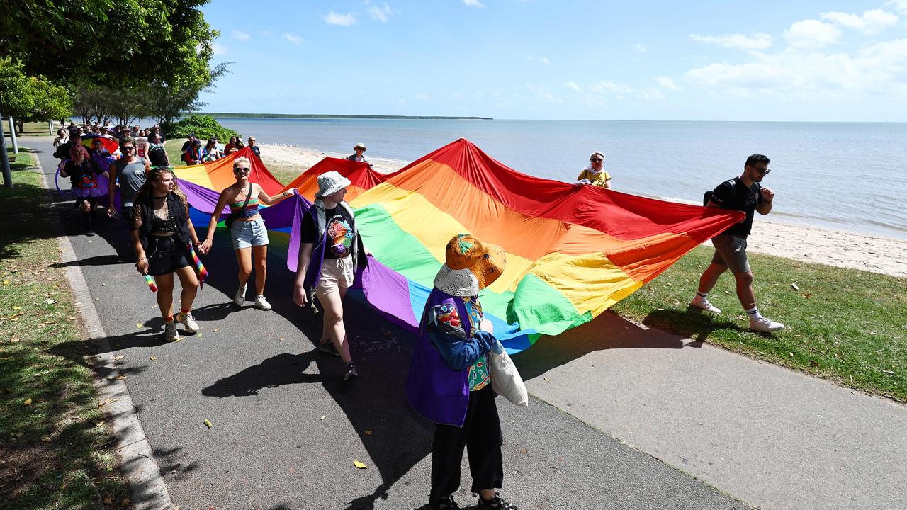 A small group of LGBTIQ people and supporters paraded along the Cairns Esplanade with a huge rainbow flag for the Pride Stride, part of the Cairns Pride Festival. Picture: Brendan Radke