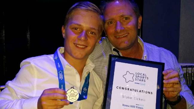 Blake with his dad Darren at the Junior Sports Stars awards night.