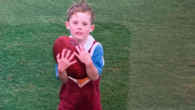 Geelong player Jed Bews as a child, wearing a Brisbane Bears jumper. Picture: Instagram