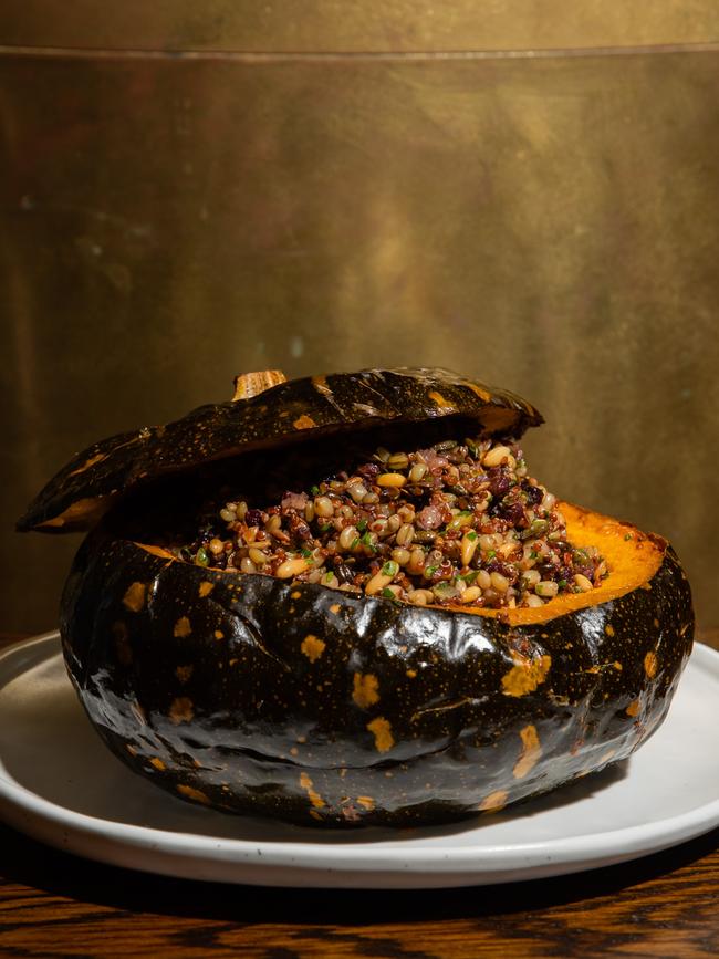 Whole roasted pumpkin with shiitake, currents, seeds and nuts. Picture: Nikki To