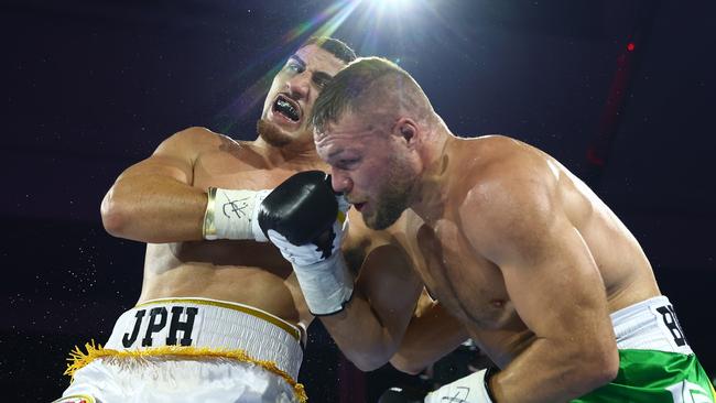 Justis Huni lands a huge shot on Joe Goodall. Picture: Chris Hyde/Getty