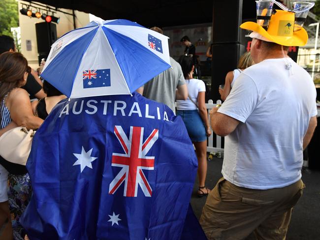 People are seen during Australia Day celebrations at the Story Bridge Hotel in Brisbane, Sunday, January 26, 2020. The Story Bridge Hotel celebrates Australia Day by holding annual cockroach races. (AAP Image/Darren England) NO ARCHIVING