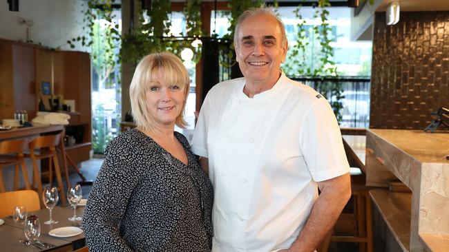 Mary Randles and Philip Johnson at their restaurant E’cco Bistro, Newstead, which takes an $89 holding deposit on bookings. Picture: Liam Kidston.