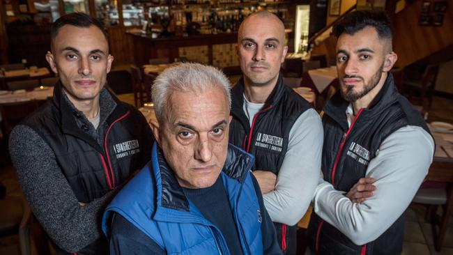 Michael Choucair and his sons Youssef, Jamil and Abraham run Italian restaurant La Spaghetteria which will close next year as Lygon St struggles. Picture: Jake Nowakowski