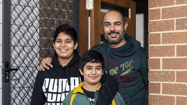 Adnan Ali poses for a photo with his sons Qasim Adnan 13 and Taha Adnan 10 outside their home in Schofields. They attend Schofields Public School which is being redeveloped. (Image / Monique Harmer)