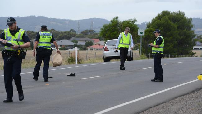 Police at the scene of the fatal accident on Black Rd, O'Halloran Hill. Picture: AAP / Brenton Edwards