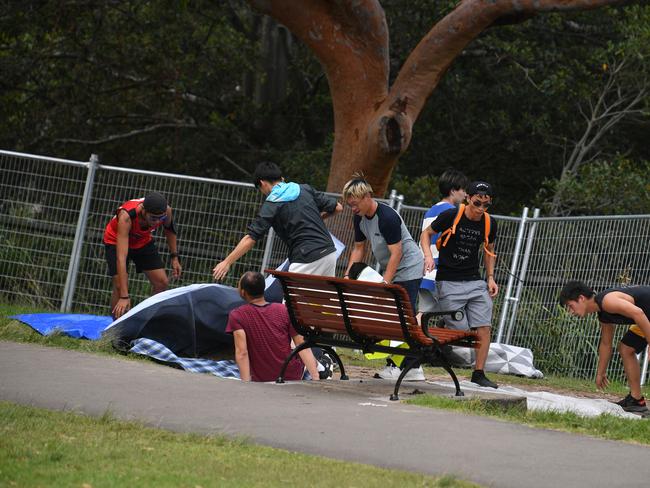 People are seen setting up at Mrs Macquarie's Point in preparation for New Years Eve Fireworks in Sydney, Monday, December 31, 2018. Picture: AAP / Brendan Esposito