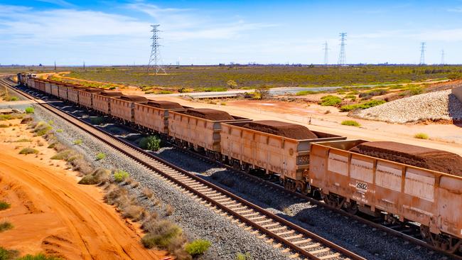 A freight train carrying iron ore travels along a rail track towards Port Hedland. Picture: Bloomberg