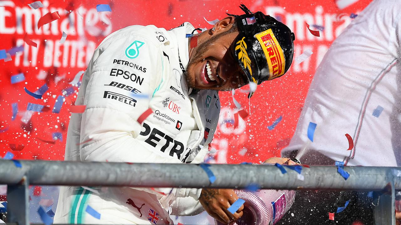 Lewis Hamilton celebrates on the podium in Austin. Picture: Clive Mason