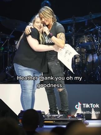 The star hugs his fan after she tells him how his music has helped her during her mental health struggles.