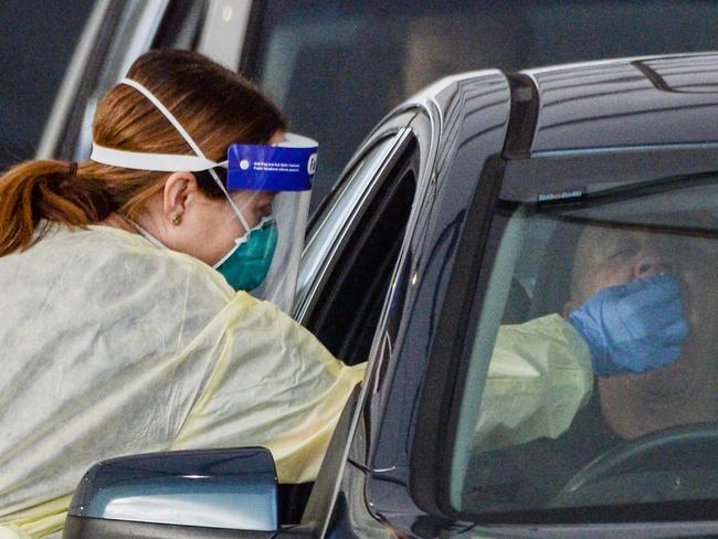 ADELAIDE, AUSTRALIA - NewsWire Photos JULY 01, 2021 -  Lines of cars and health workers at the Victoria Park Covid testing clinic in Adelaide. Picture: NCA NewsWire / Brenton Edwards