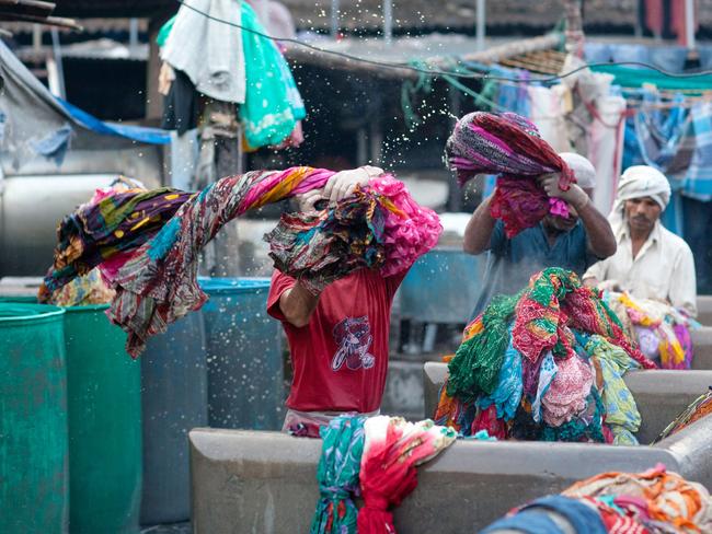 Workers wash  clothes at Dhobi Ghat, an open-air laundromat in Mumbai.