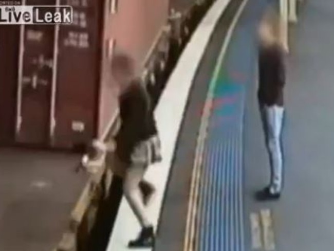 The girl takes a death defying leap onto the moving train. Source: www.liveleak.com