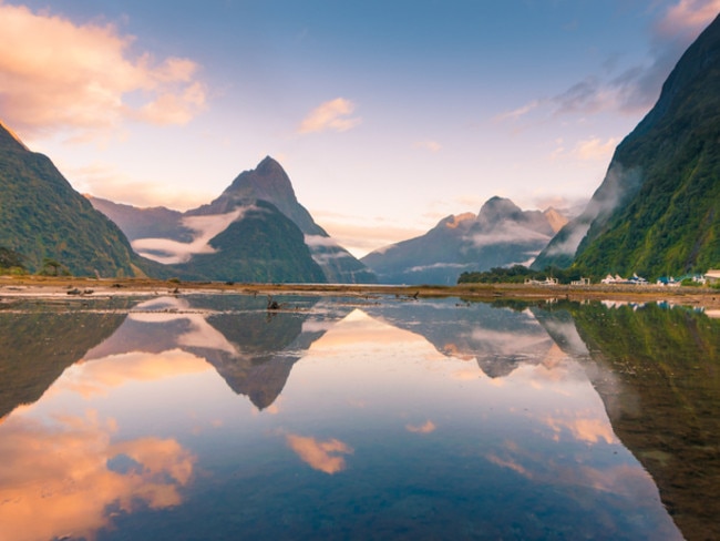 Famous Mitre Peak rising from the Milford Sound fiord. Fiordland national park, New Zealand