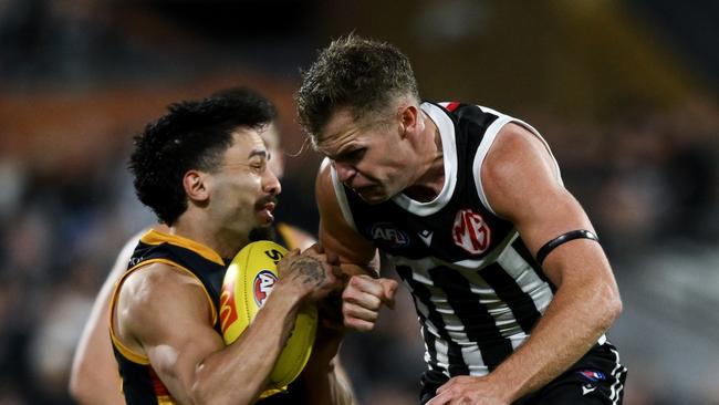 ADELAIDE, AUSTRALIA – AUGUST 17: Izak Rankine of the Crows is knocked out by a late hit from Dan Houston of the Power during the round 23 AFL match between Port Adelaide Power and Adelaide Crows at Adelaide Oval, on August 17, 2024, in Adelaide, Australia. (Photo by Mark Brake/Getty Images)