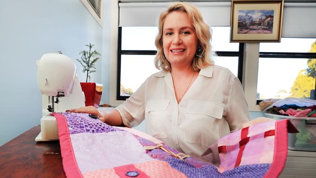 The Tweed Hospital nurse Erin Davis with one of her sensory blankets she hand makes for dementia patients at her home in Coolangatta. Picture: Scott Powick.