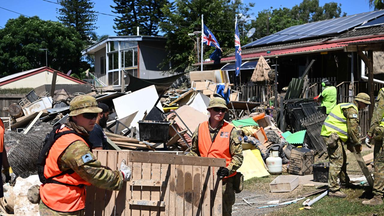 Members of the Australian Defence Force (ADF) help with the clean up of flood affected properties in Goodna, west of Brisbane. Picture: NCA NewsWire / Dan Peled