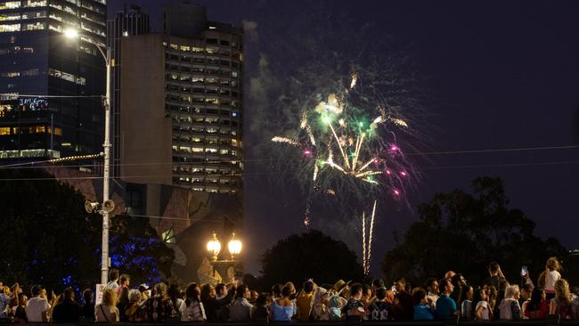 People watch the 9.30pm fireworks from Princes Bridge, Melbourne. Picture: Mark Stewart