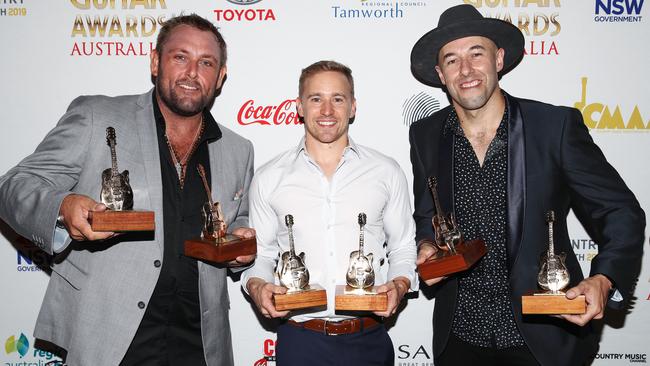 The Wolfe Brothers pose with their four awards, including Album of the Year award, during the 47th Tamworth Country Music Festival in Tamworth. Picture: AAP