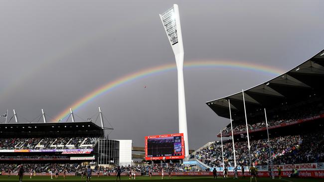 A double rainbow is seen as Patrick Dangerfield kicks for goal against Fremantle. Pic: AAP