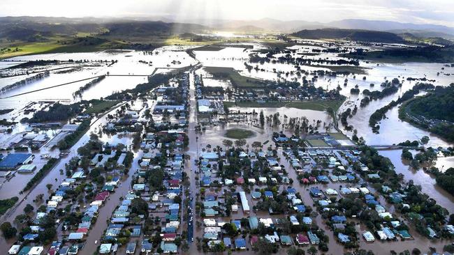 An aerial photograph of floodwaters engulfing residential housing in central Lismore, New South Wales, Friday, March 31, 2017. The Wilsons River breached its banks early this morning flooding, the far-northern NSW town. (AAP Image/Dave Hunt) NO ARCHIVING. Picture: DAVE HUNT