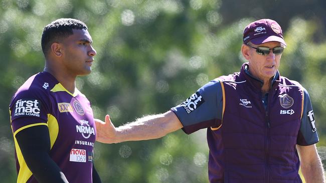 Tevita Pangai Junior and coach Wayne Bennett are seen during the Brisbane Broncos training session in Brisbane, Wednesday, August 22, 2018.  (AAP Image/Dave Hunt) NO ARCHIVING