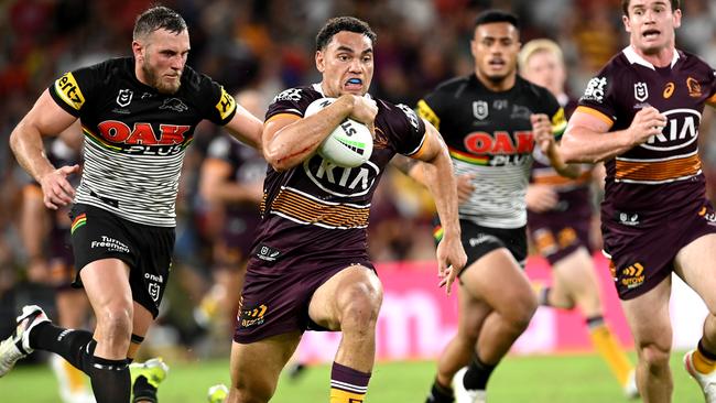 BRISBANE, AUSTRALIA - APRIL 15: Xavier Coates of the Broncos breaks through the defence during the round six NRL match between the Brisbane Broncos and the Penrith Panthers at Suncorp Stadium, on April 15, 2021, in Brisbane, Australia. (Photo by Bradley Kanaris/Getty Images)