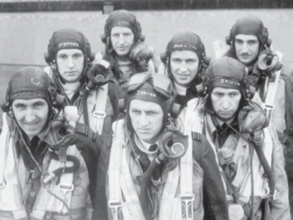 A RAAF crew of a Lancaster Bomber from No 460 Squadron RAAF. Left to right: 408034 Flying Officer (FO) M. W. Carroll DFC of Ferntree Gully, Vic; Sergeant D. G. Champkin, RAF; 414807 Pilot Officer T. J. Lynch of Toowoomba, Qld (back); 404507 Squadron Leader E. G. D. Jarman DFC (Captain) of Yeppoon, Qld (centre front); 404467 Flying Officer (FO) H. R. Harrison of Lismore, NSW; 404503 FO F. G. Jackson DFC OF Lismore, NSW; 411227 FO R. L. Neal of Grenfell, NSW.