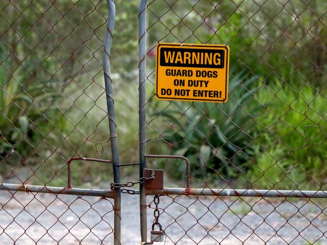 A sign at the address read “Warning - Guard dogs on duty”. Picture: David Clark