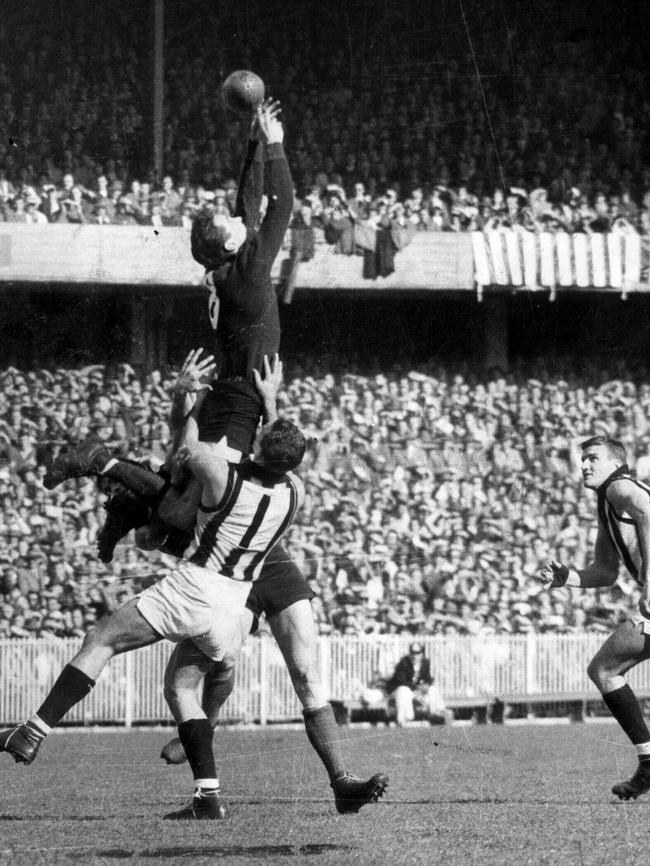 Robert “Tassie” Johnson' marks over Murray Weideman in 1960.