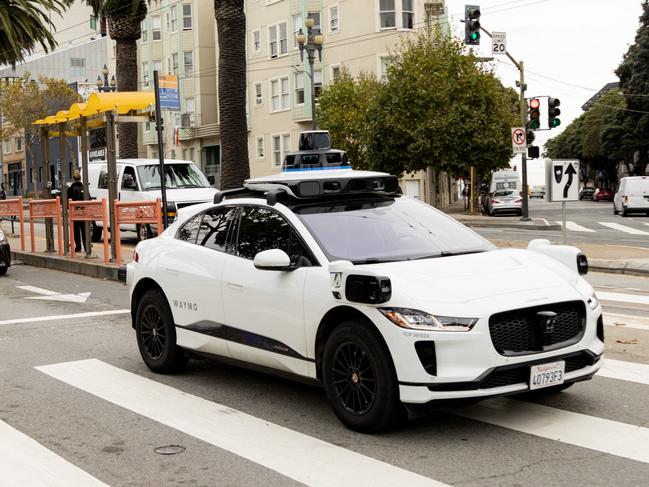 A Waymo autonomous vehicle on Market Street in San Francisco, on November 17, 2023. (Photo by Jason Henry / AFP)