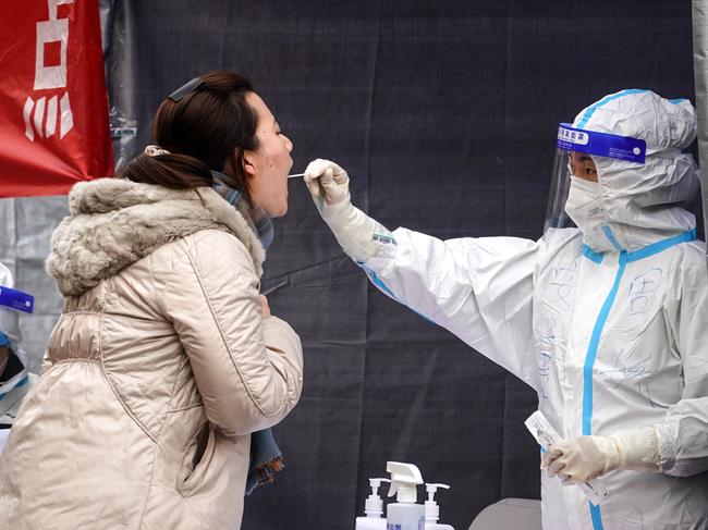 A resident undergoes a nucleic acid test for Covid-19 in Xi'an in China's northern Shaanxi province. Picture: AFP