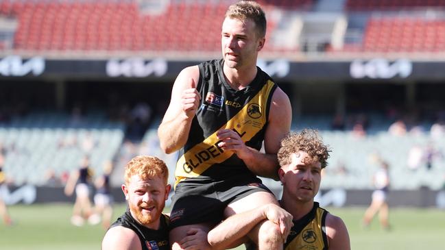 Andrew Bradley is chaired off following his 200th game after the 2022 elimination final between Glenelg and Sturt. Picture: David Mariuz