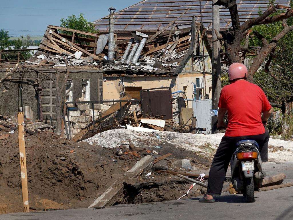 A man pauses to look at a home recently damaged by a Russian missile strike in Druzhkivka, Ukraine. Picture: Scott Olson/Getty Images