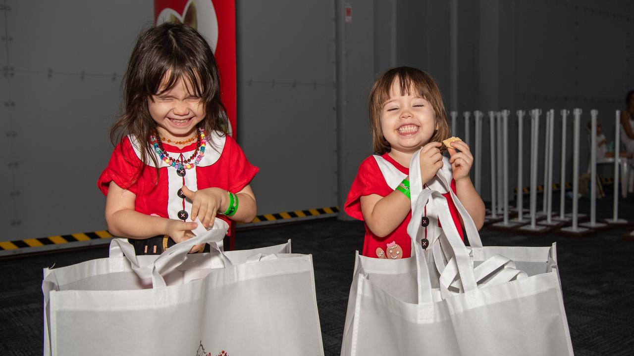 Mina and Roya Nooriafshar preparing to drag their presents home. Picture: Pema Tamang Pakhrin