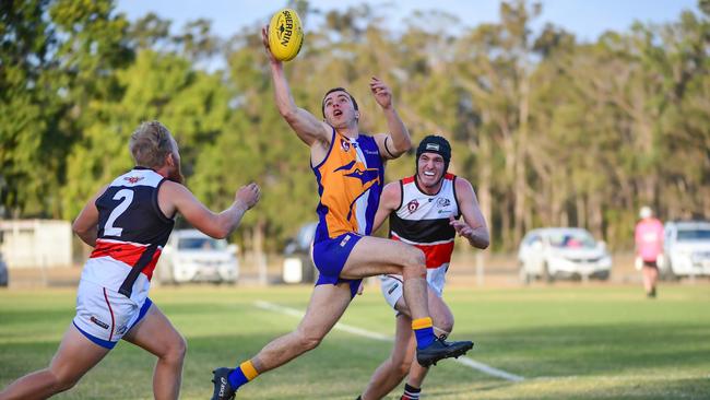 <s1>RISE: The Waves’ Zach Smithers takes the ball on the run in the Bundy derby last year. AFL Wide Bay looks set to continue but it is for the clubs to decide later this month. Photo: Brian Cassidy</s1>