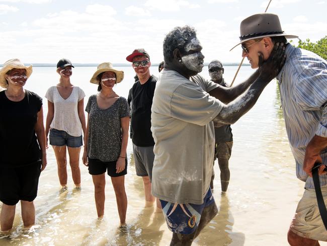 Timmy invites the group to join his family for a fish. Picture: David Dare Parker