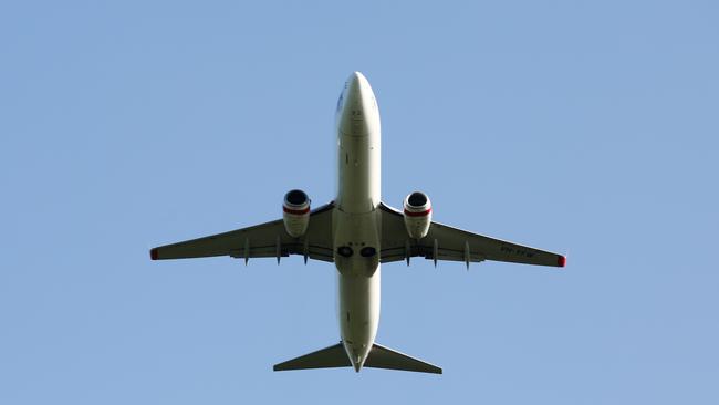 A Virgin Australia passenger jet plane bound for Brisbane has been forced to land in Alice Springs after a passenger fell ill. Picture: BRENDAN RADKE