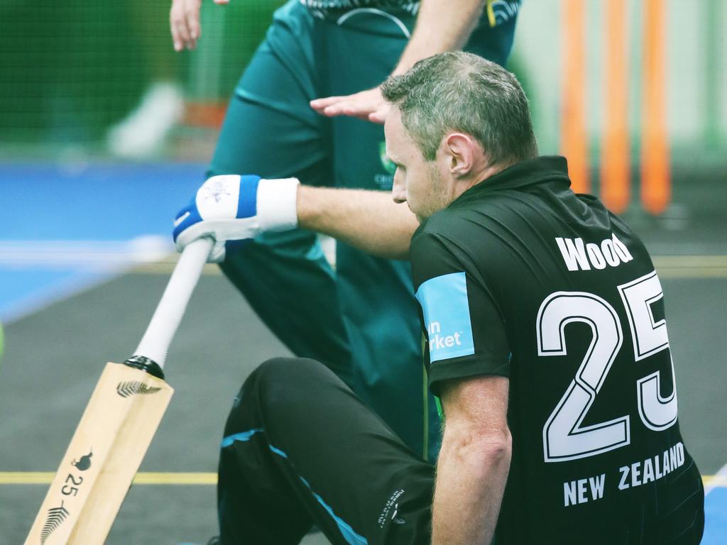 The Trans Tasman trophy for indoor cricket is being played on the Gold Coast at Ashmore. Australia v New Zealand Mens 40s . Kiwi Michael Wood goes down for the count as Aussie Adam Landrigan rushes by. Picture Glenn Hampson