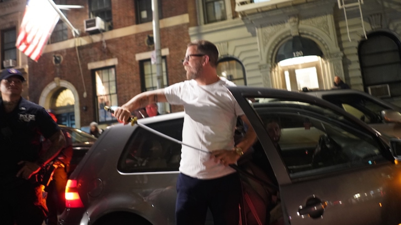 Gavin McInnes, founder of the far-right group The Proud Boys, brandishes a samurai sword after giving a speech in New York.