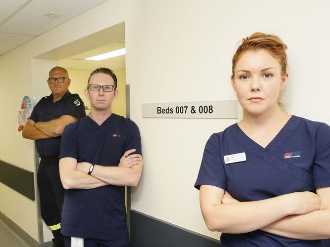 Sydney Local Health District Fire safety officer Rod Brown with registered Nurse Simon Latham and Midwife Tarryn O'Loughlin in RPA's new Fire simulation unit. Picture: John Appleyard